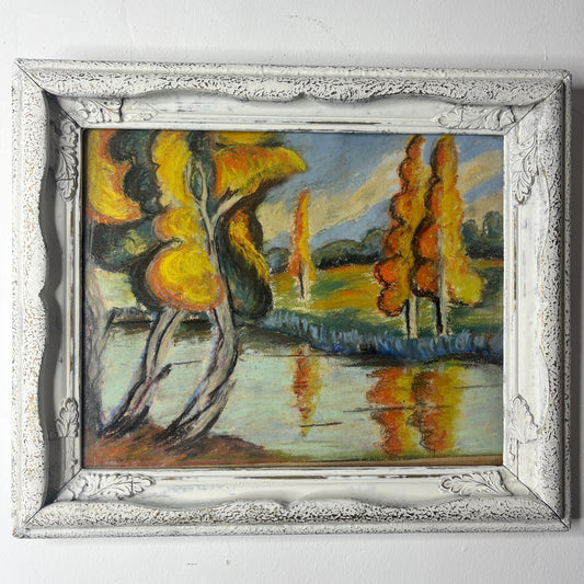 Painting of a landscape with trees and water in a decorative frame.