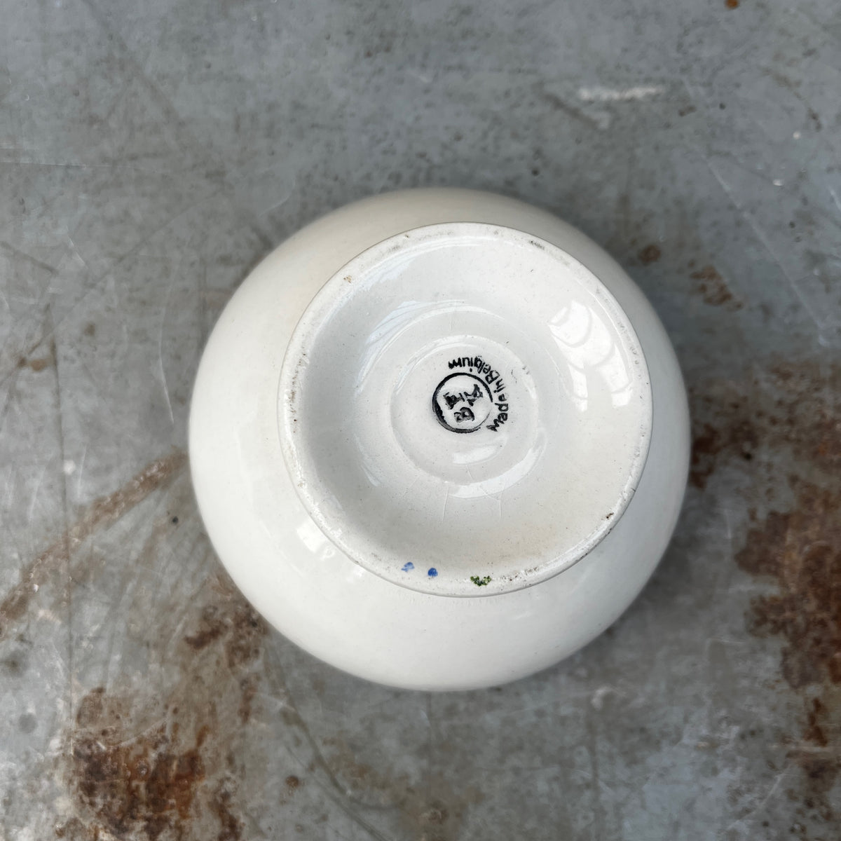 Vintage café au lait bowls with a maroon geometric pattern around the rim.