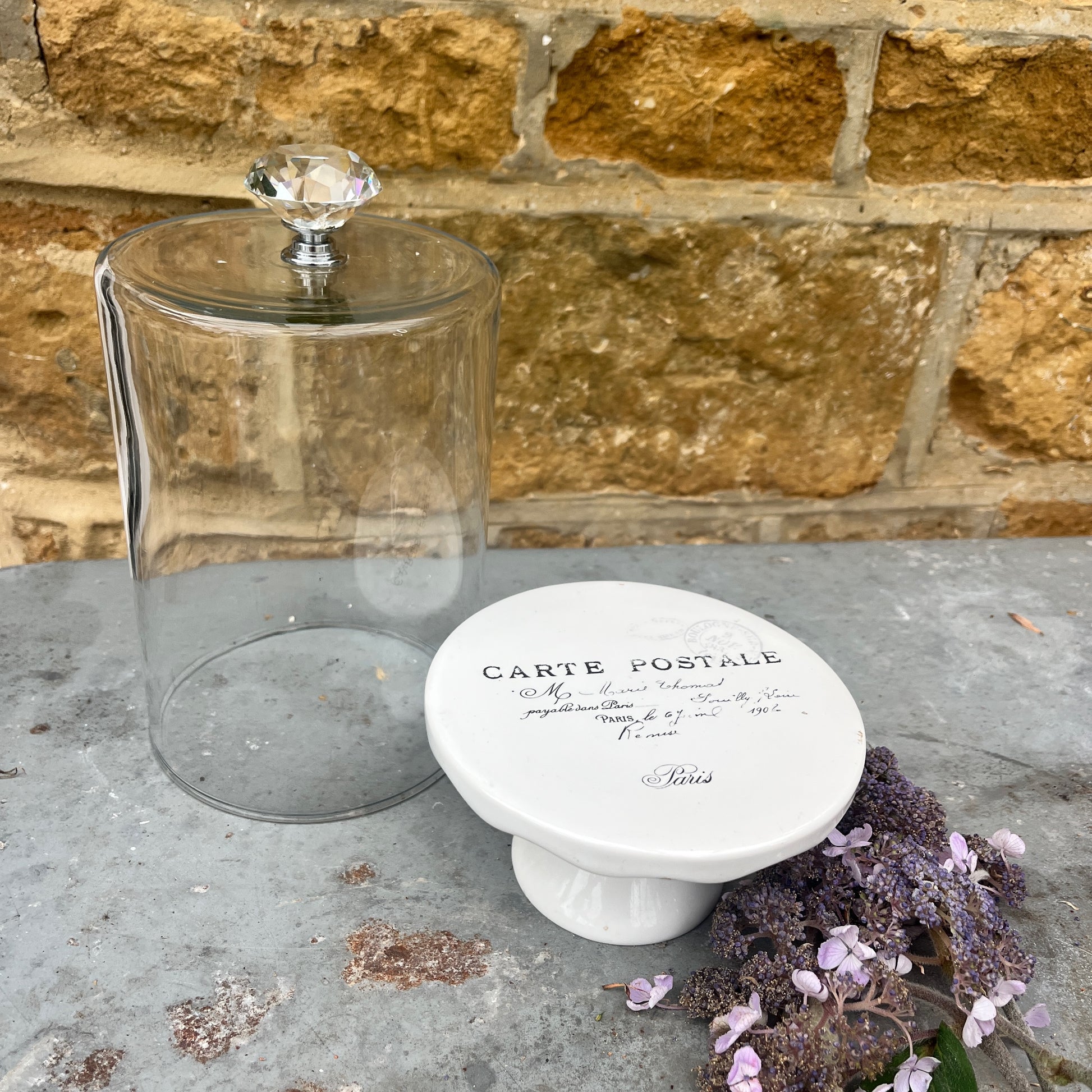 Clear glass dome on a small french styled cake stand