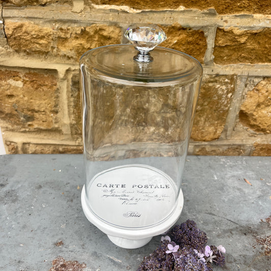Clear glass dome on a small french styled cake stand