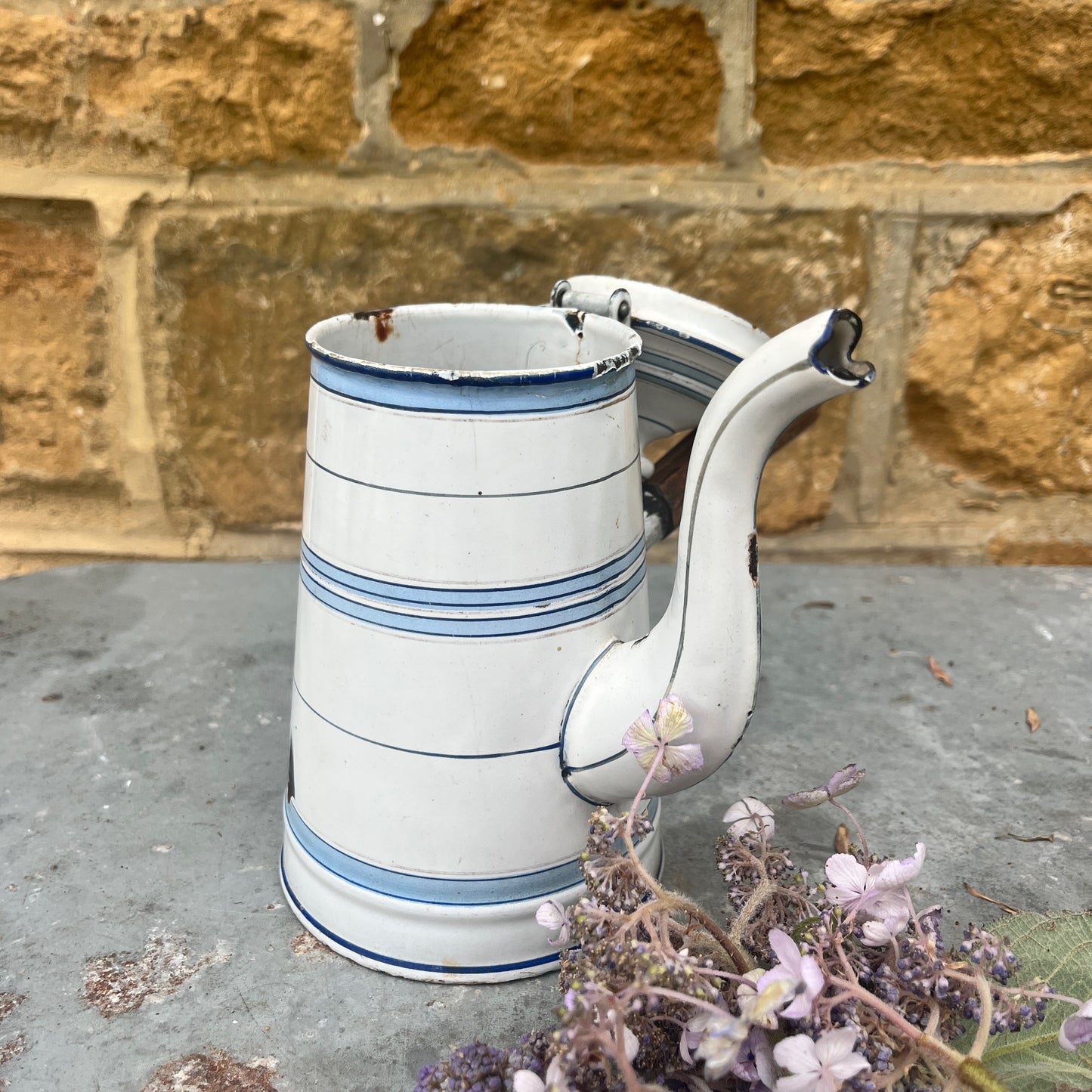 White enamel coffee pot with blue stripes