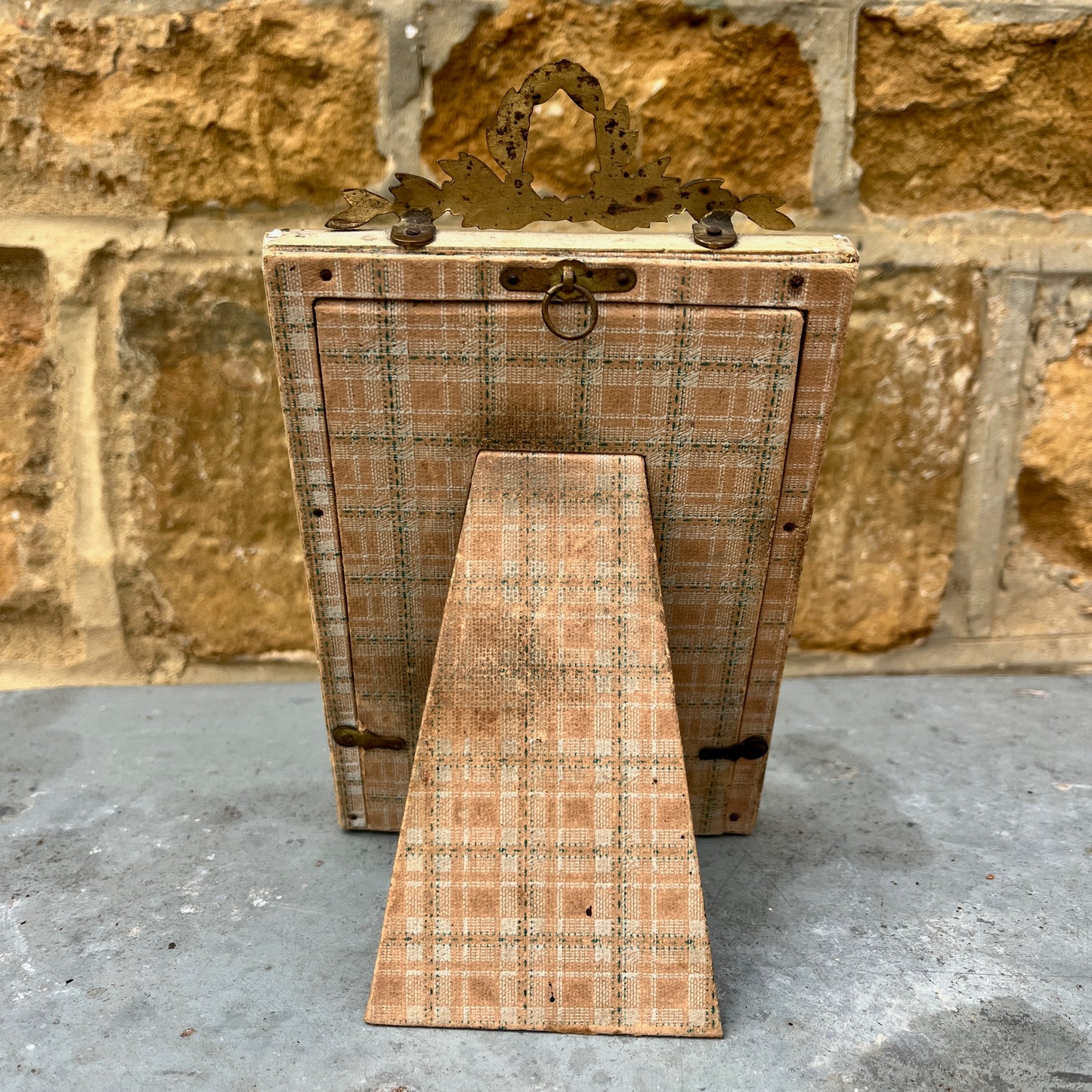 Wooden frame with plaid design on the back and metal fixings