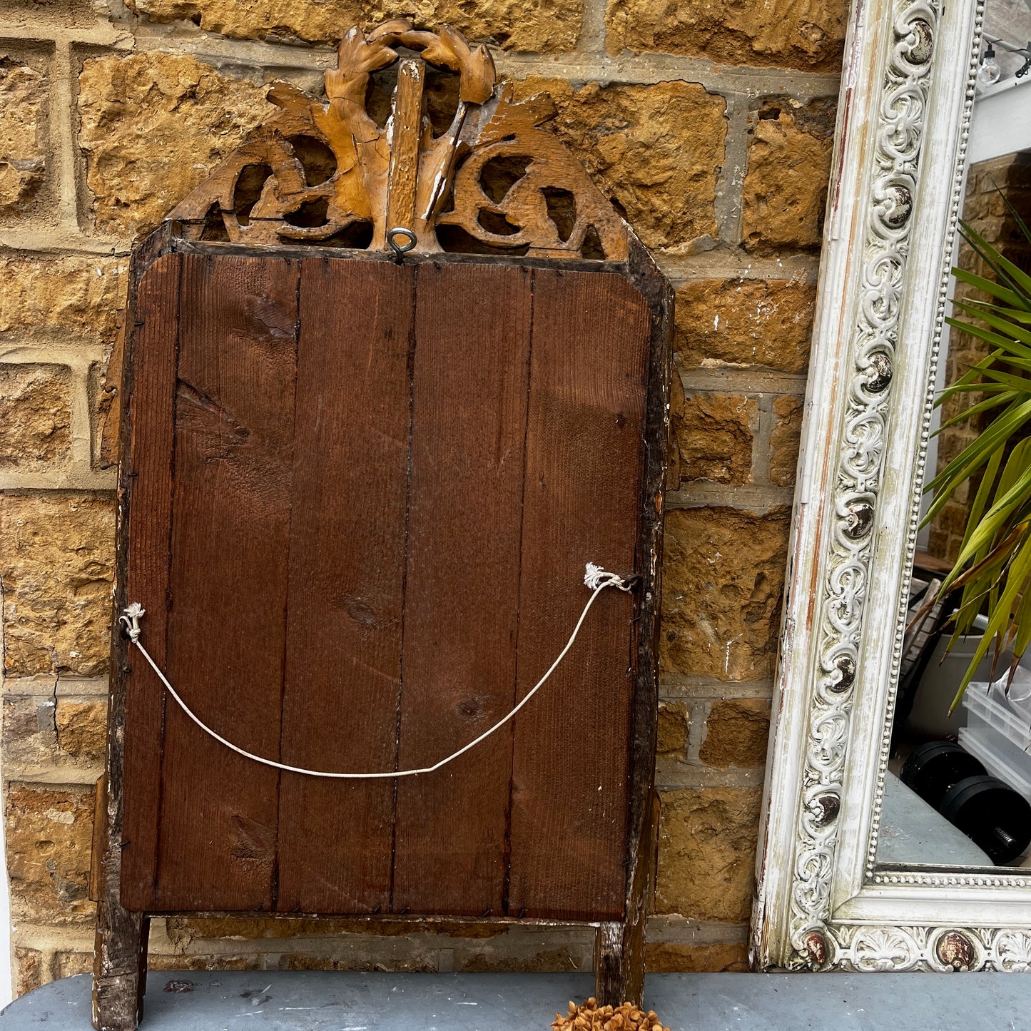 Antique French marriage mirror with an ornate gilt frame, featuring decorative gold detailing and traditional provincial craftsmanship.