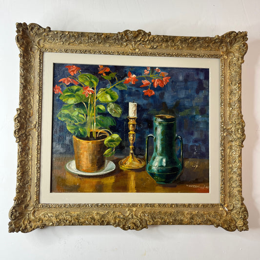 A framed  oil on board still life depicting a cluster of vibrant French geraniums in red  hues, arranged with a classic candle and drinking vessel. The composition is set against a rich blue background, with textured brushstrokes adding depth, and exuding charming, and rustic elegance
