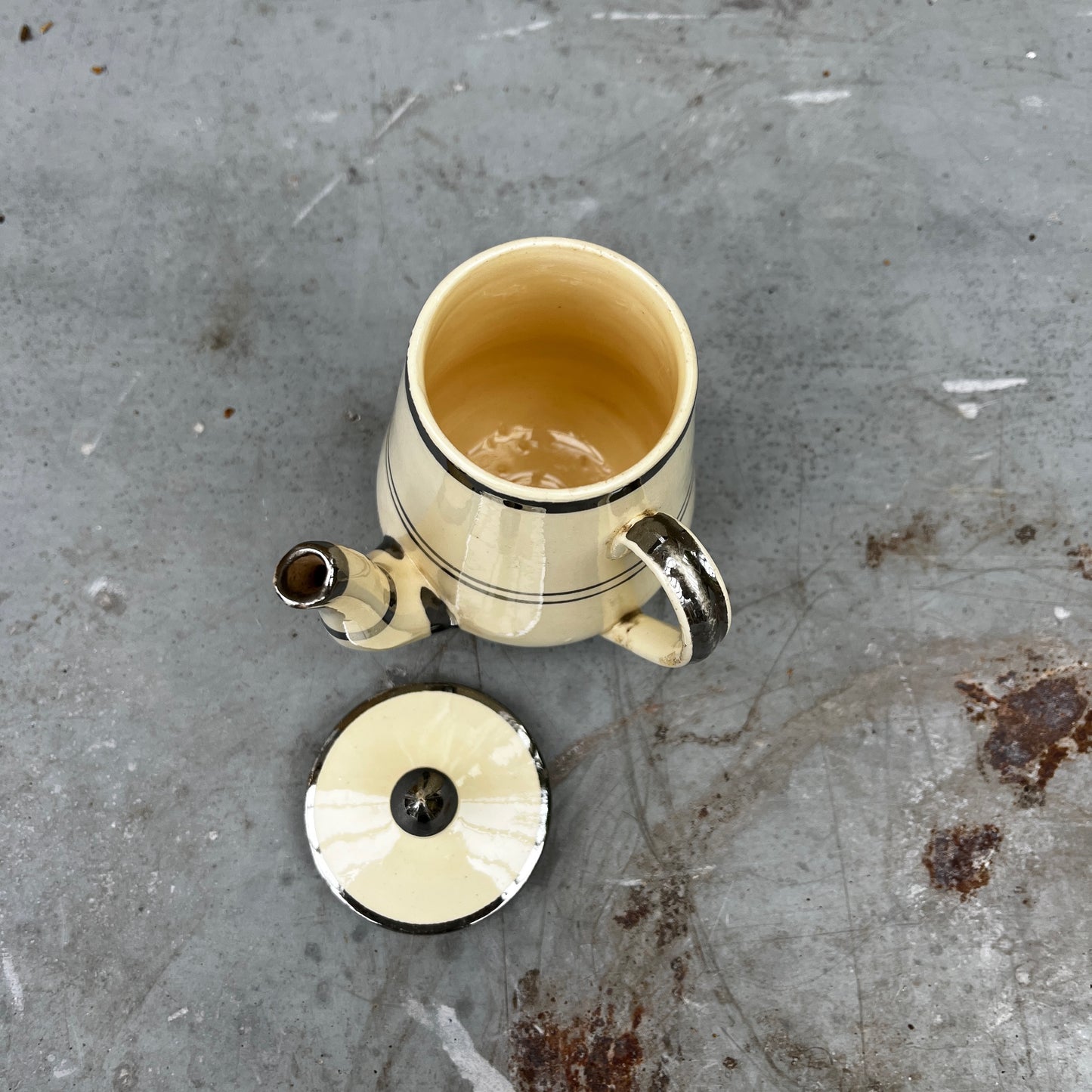 Cream-colored vintage French pot featuring delicate gilded detailing around the rim. The pot has a classic, rounded shape with a smooth glazed finish, reflecting elegant French country style.