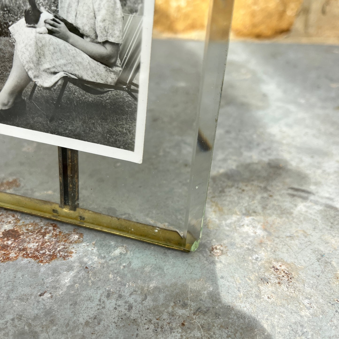 Vintage photo  frame containing a black and white photo of a woman