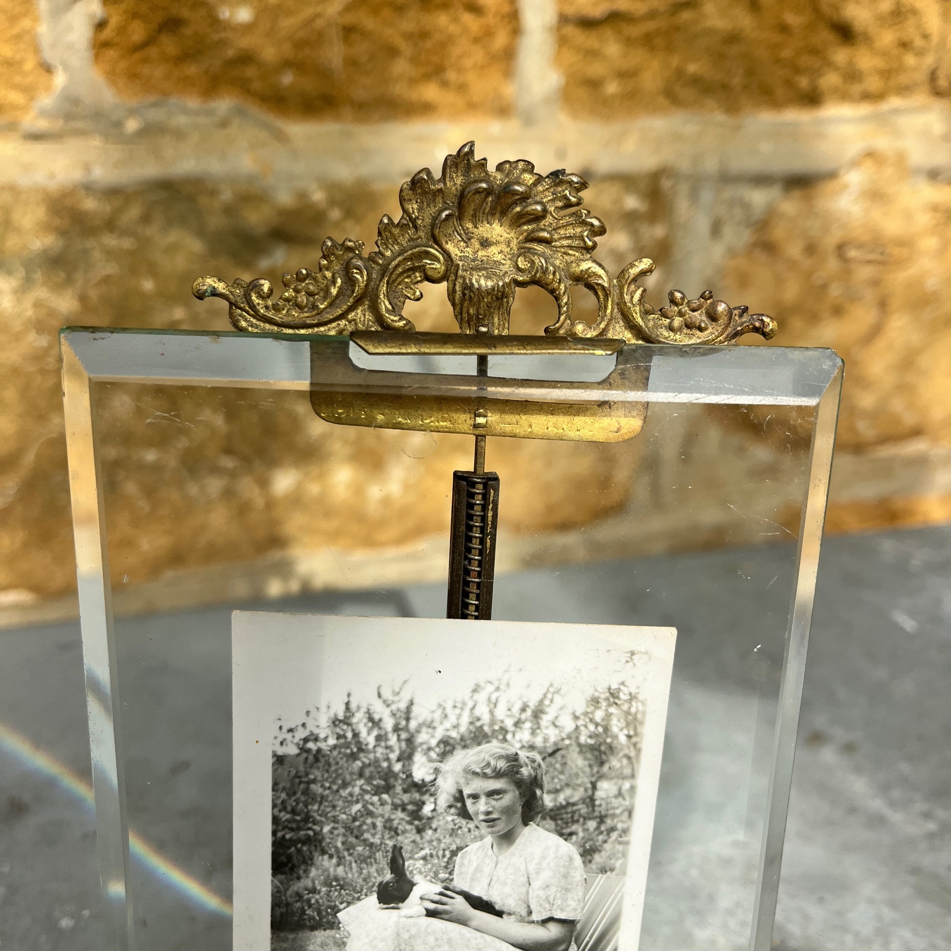 Vintage photo  frame containing a black and white photo of a woman