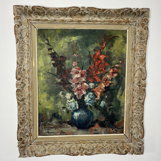 Oil on canvas still life painting of flowers in a vase, featuring rich, vibrant colors, set in an ornate vintage wooden frame. Artwork signed by Hungarian painter Denes de Holesch