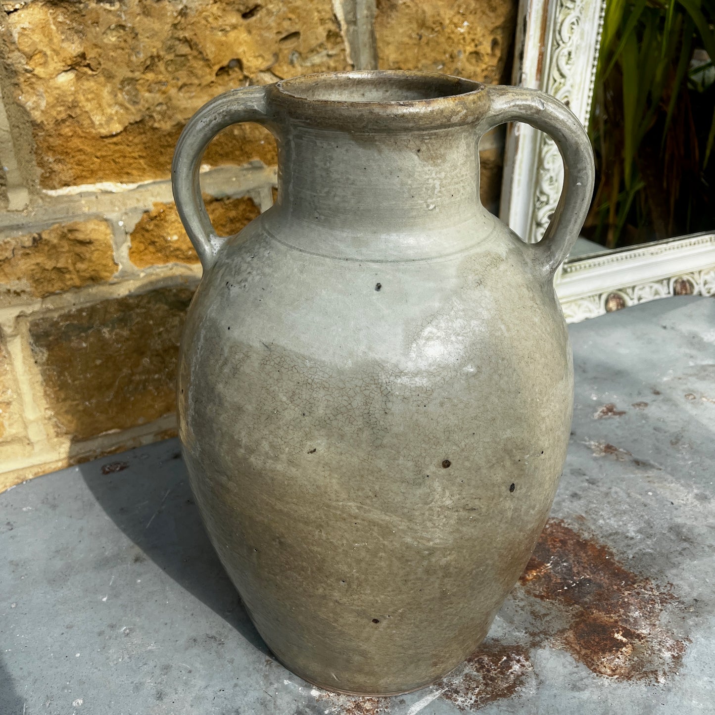 An antique glazed stoneware beehive jug with a rounded, sturdy handle, and projecting spout. The jug features a softly aged glaze with subtle variations in colour and texture, highlighting its traditional craftsmanship and rustic character.