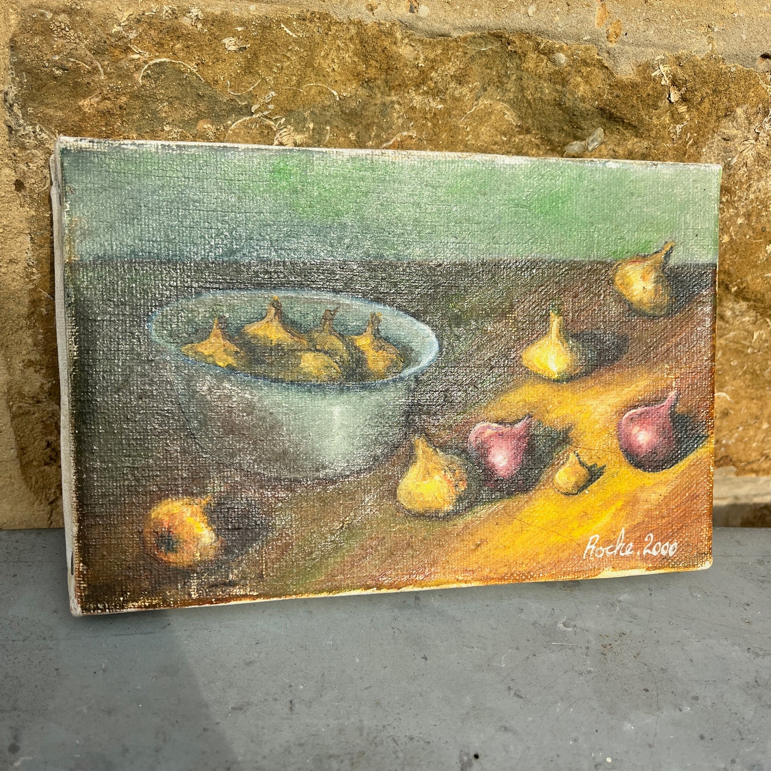 Small painting of a still life with a bowl and garlic on a textured surface