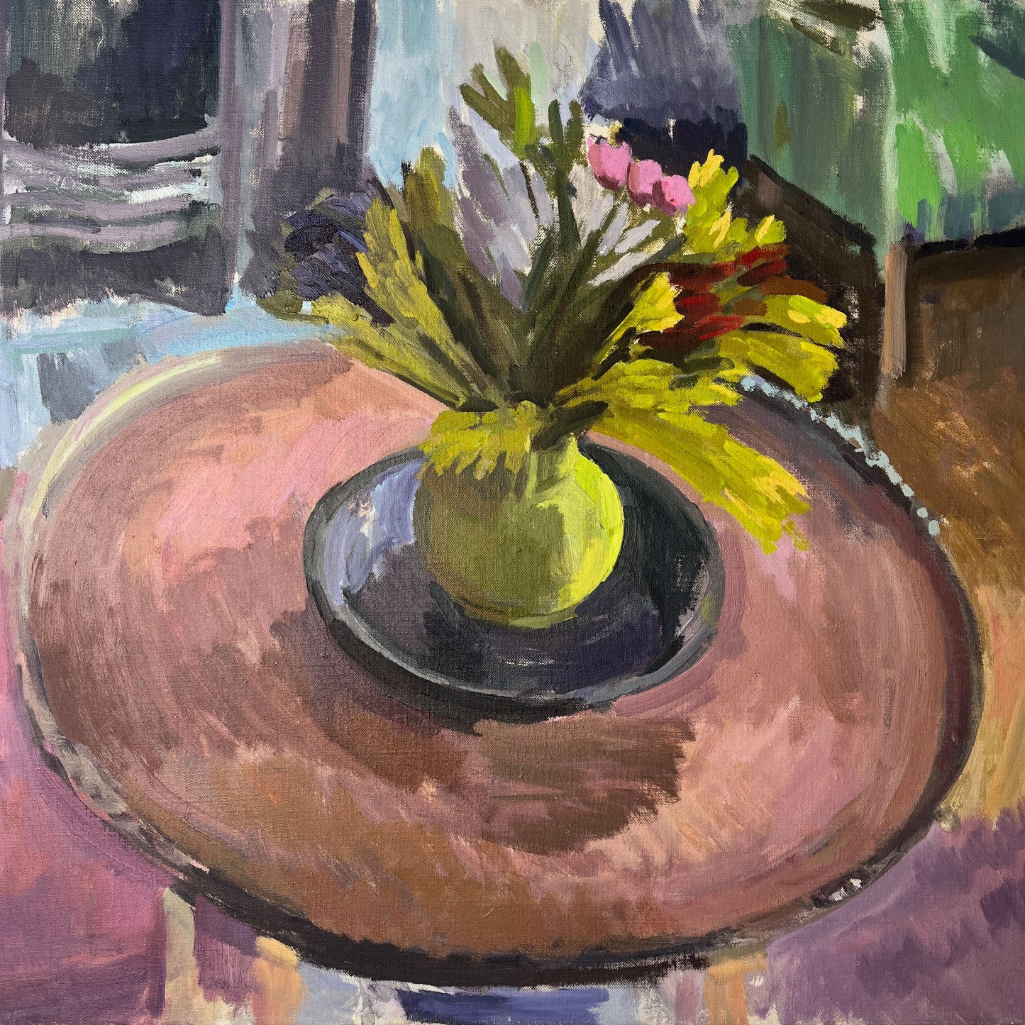 An oil-on-canvas still life painting capturing a serene living room scene, featuring a bouquet of pink tulips gracefully arranged in a green vase on a wooden table. In the room is a green armchair, and fire place, evoking a sense of quiet elegance. and coziness.