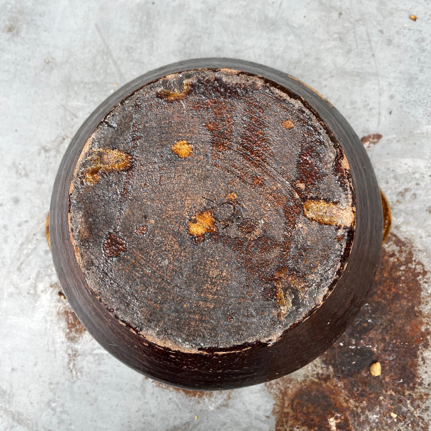 A Rustic, Glazed Redware Pot With Mottled Brown and Amber Colouration