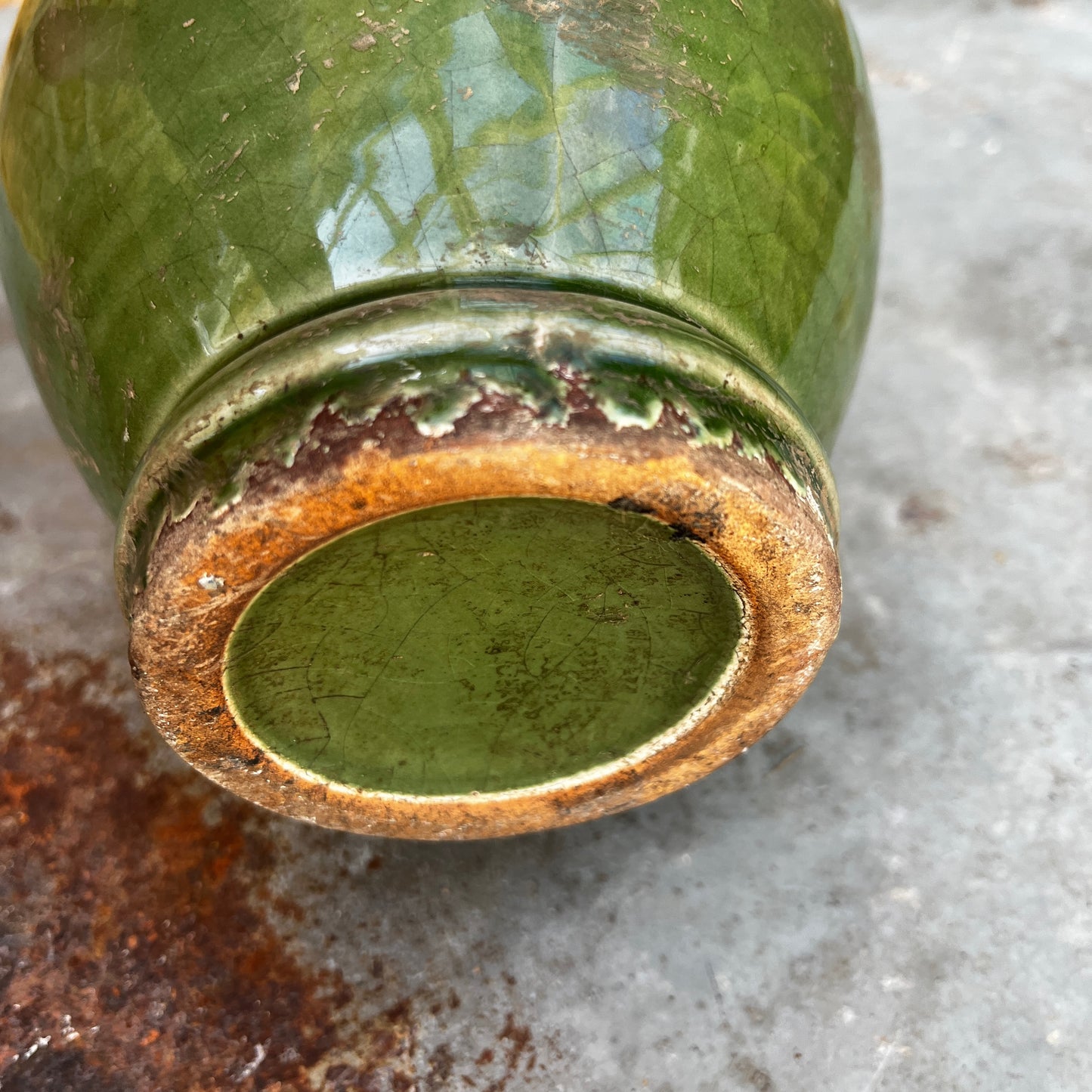 A vintage Sung-style Oriental vase with a soft green celadon glaze and an elegant, understated silhouette