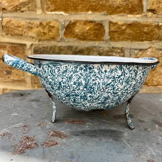 Decorative vintage enamelware colander with blue and white pattern