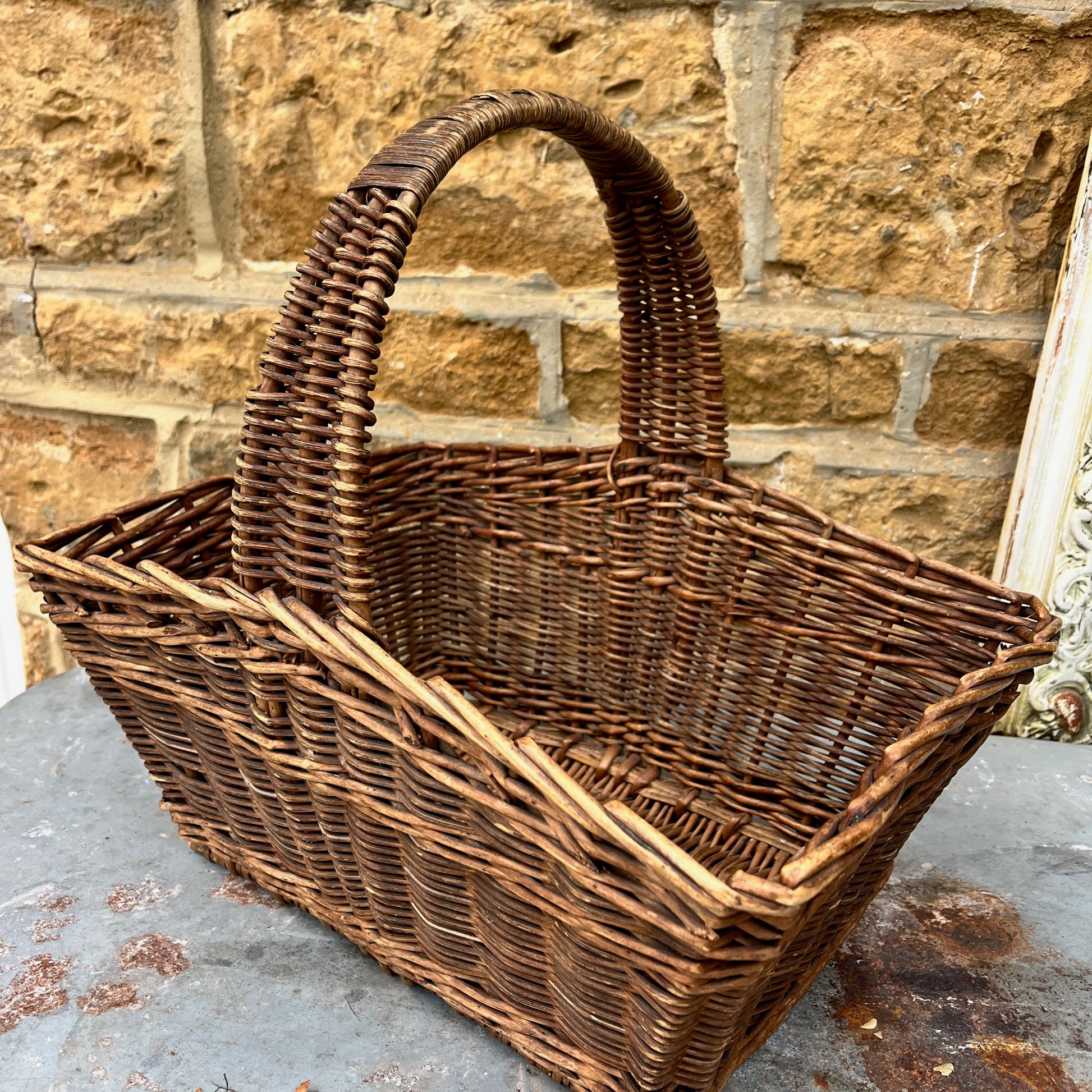 Assorted wicker baskets in various shapes and sizes, made from natural woven materials