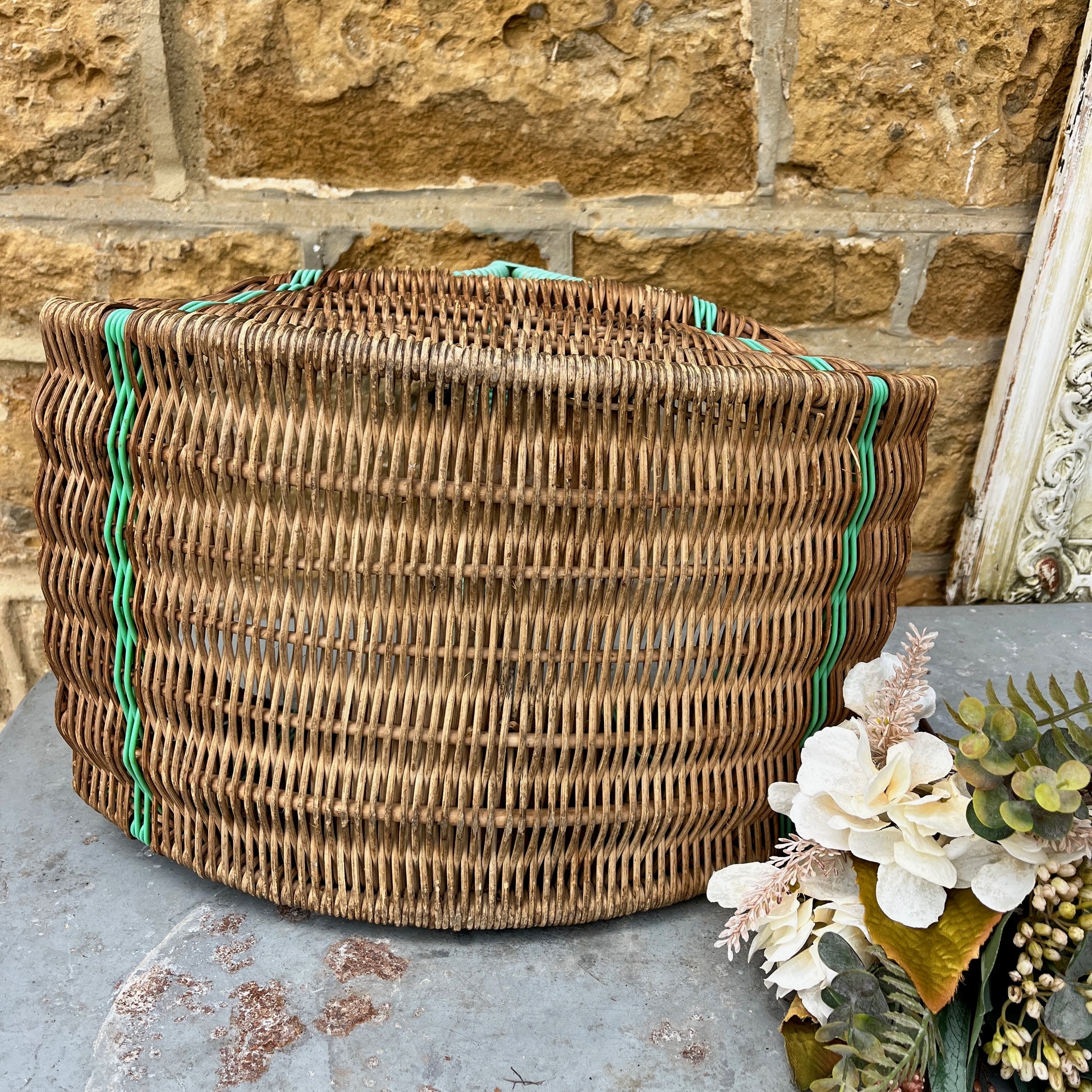 Assorted wicker baskets in various shapes and sizes, made from natural woven materials