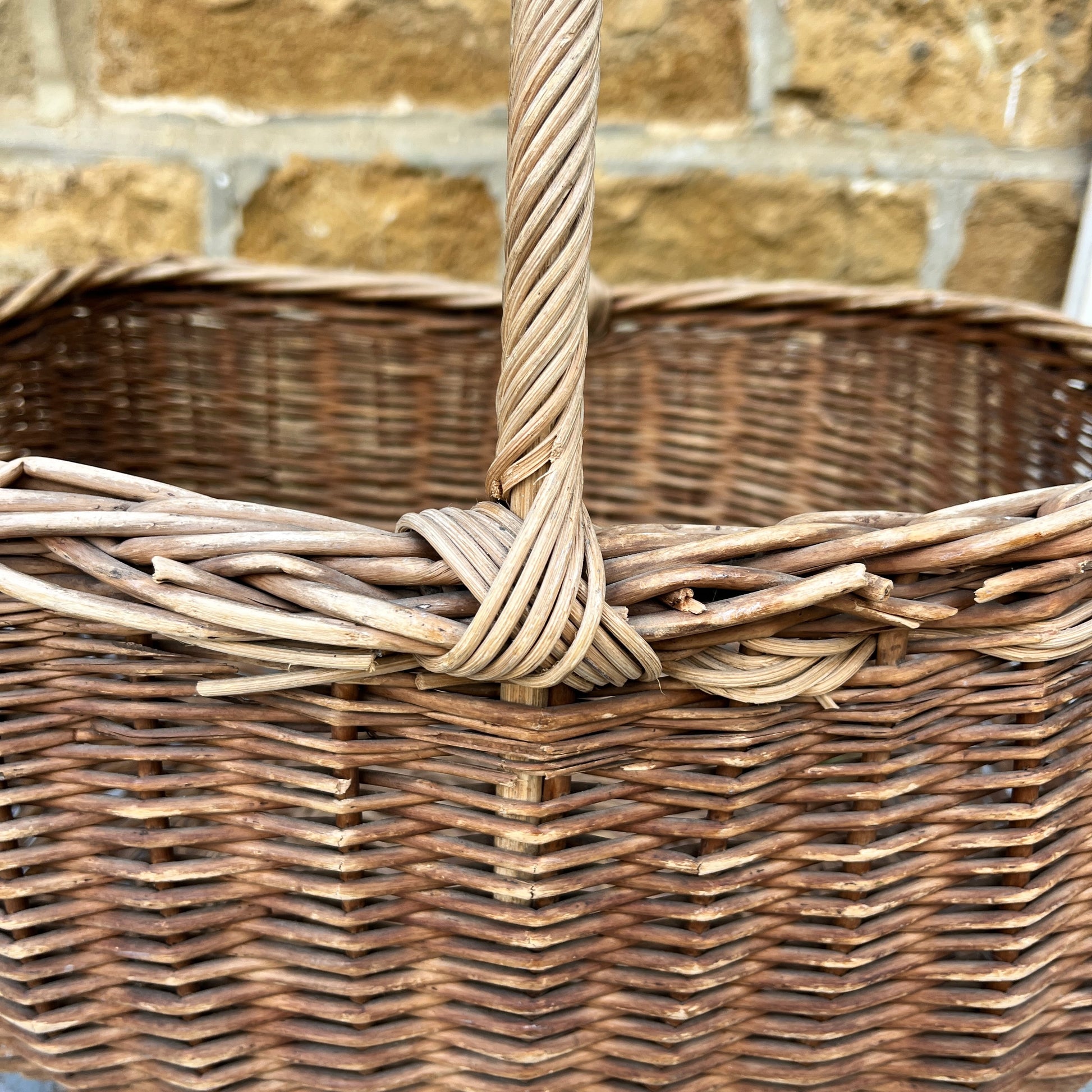 Assorted wicker baskets in various shapes and sizes, made from natural woven materials