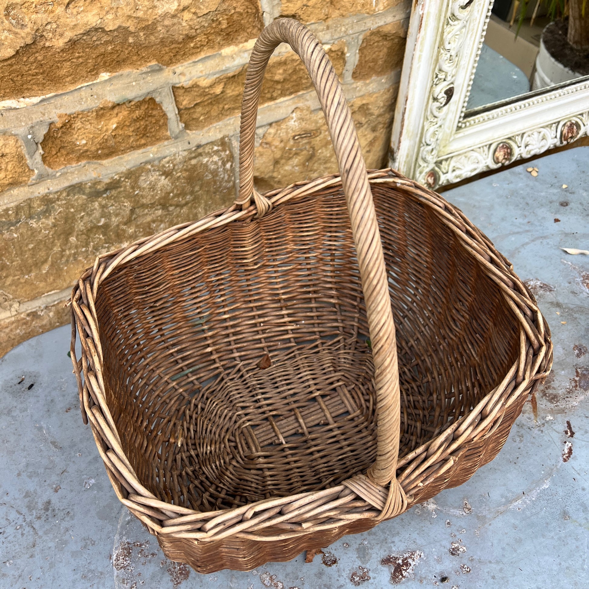 Assorted wicker baskets in various shapes and sizes, made from natural woven materials