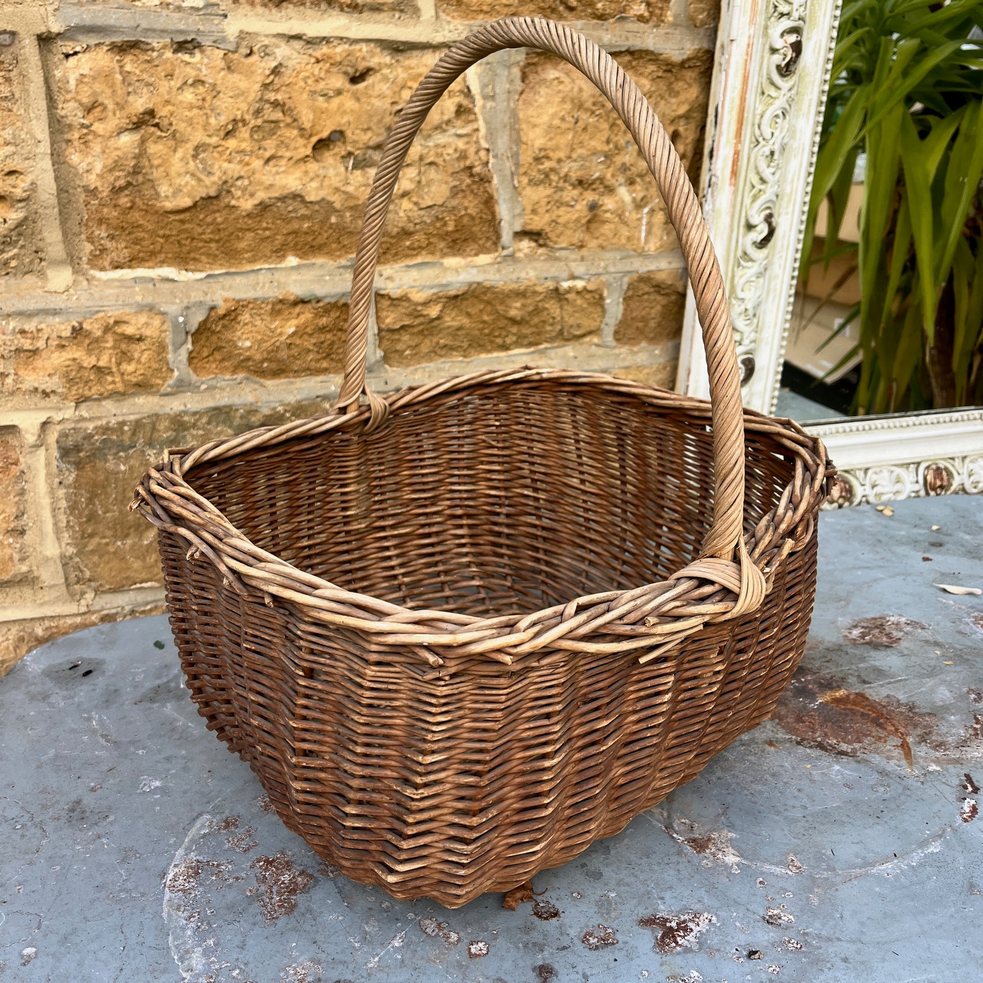 Assorted wicker baskets in various shapes and sizes, made from natural woven materials