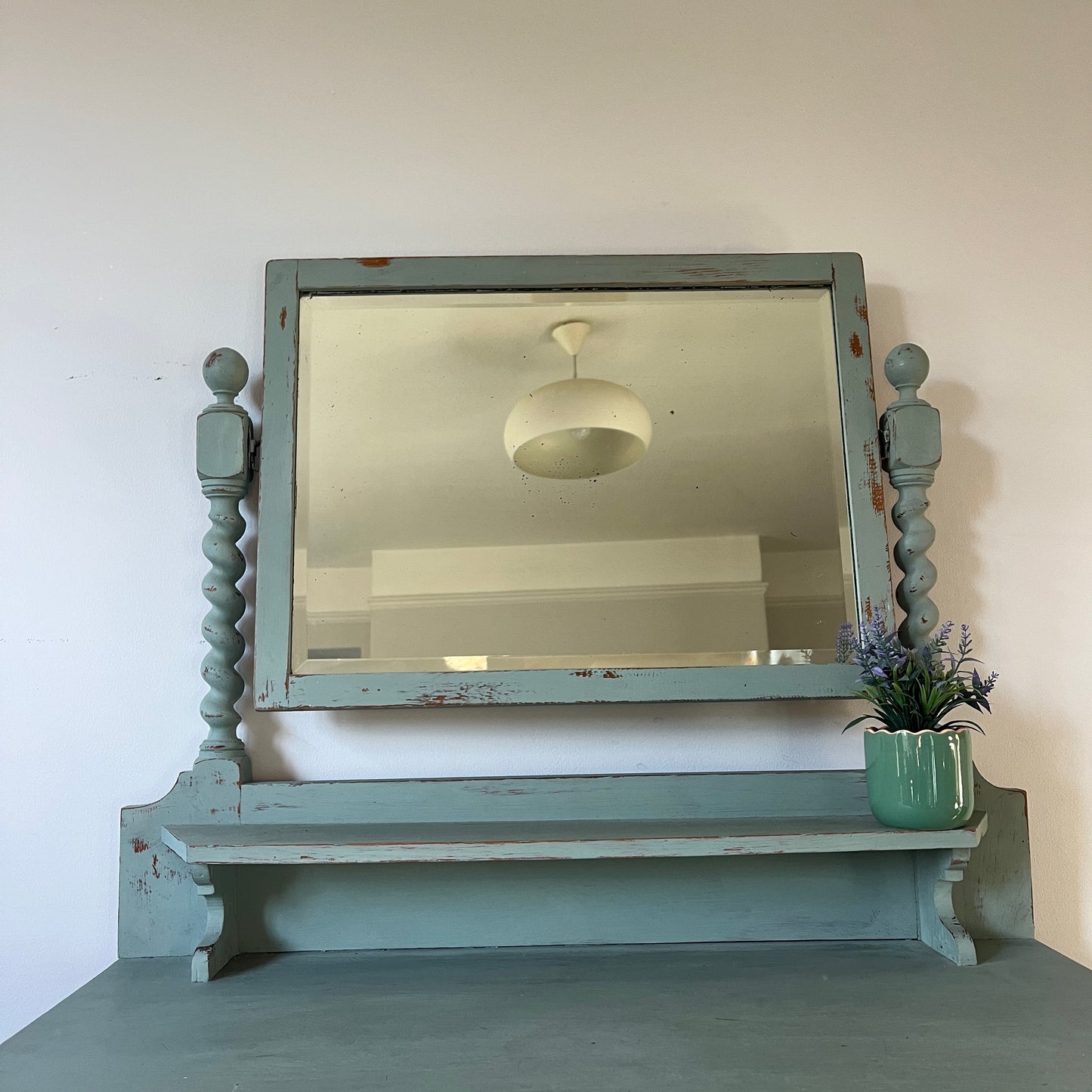 Antique wooden dressing table with a large rectangular mirror, with shelf under, featuring intricately carved barley twist legs and two drawers