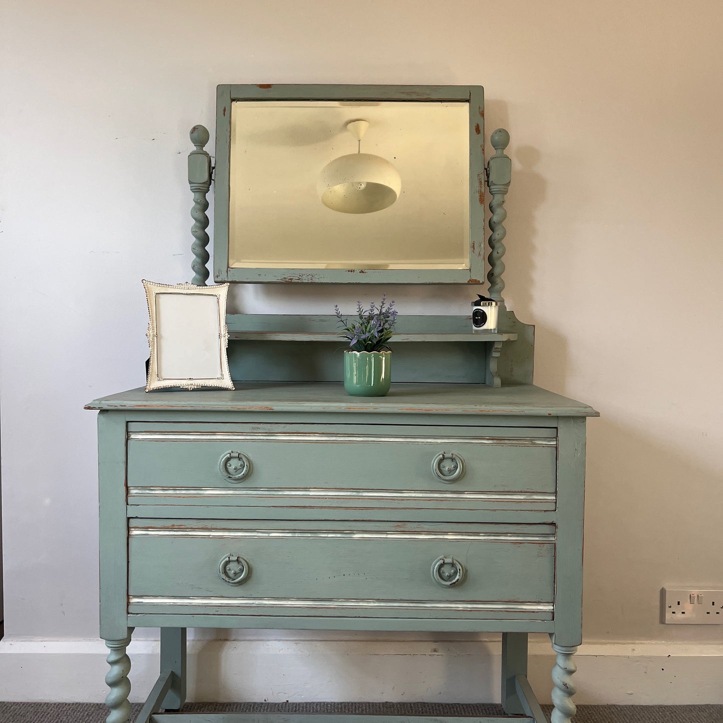 Antique wooden dressing table with a large rectangular mirror, with shelf under, featuring intricately carved barley twist legs and two drawers