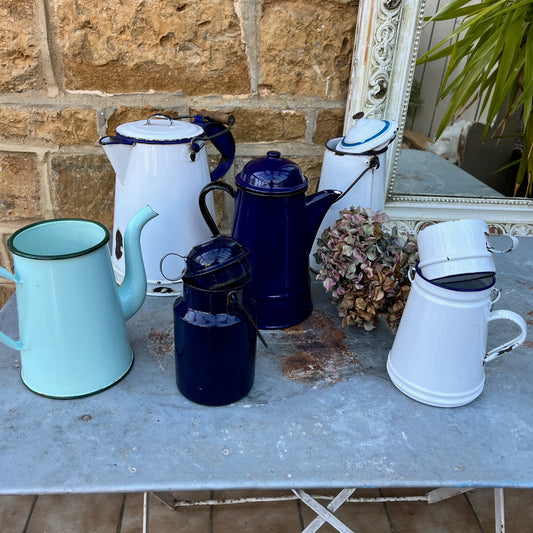 Collection of vintage enamel wear including jugs, coffee pots, milk churns and billy cans