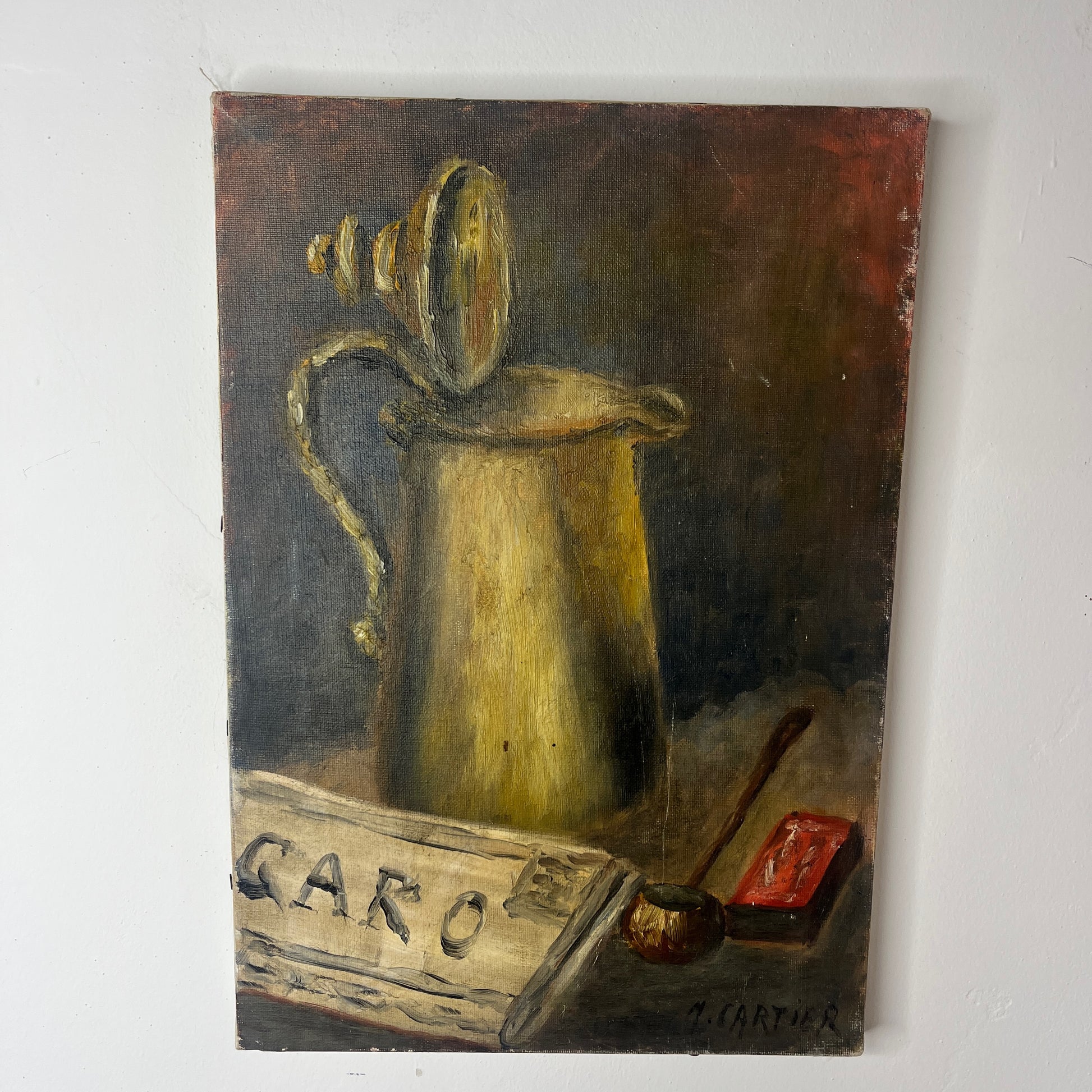French oil on canvas still life of Le Figaro newspaper, a coffee pot, pipe and matches.  Gold, browns and reds in the painting.  Signed M Cartier