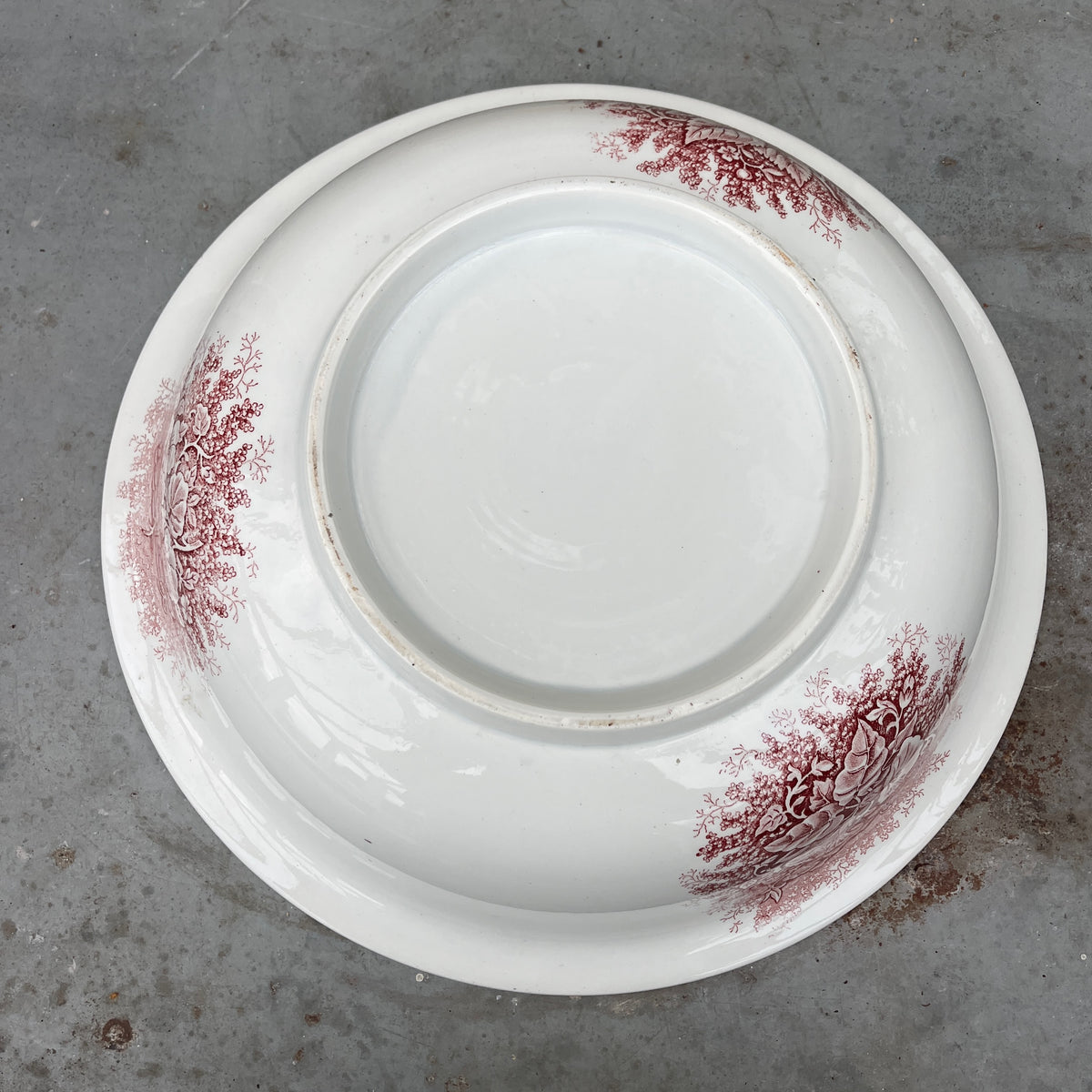 19th-century French ironstone washbasin with a traditional transfer-printed decorative pattern.