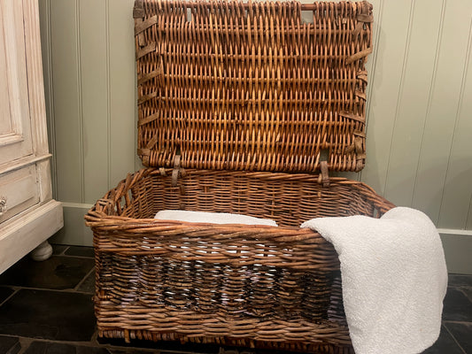 Vintage laundary basket made from wicker ideal for storing bedding or towels.