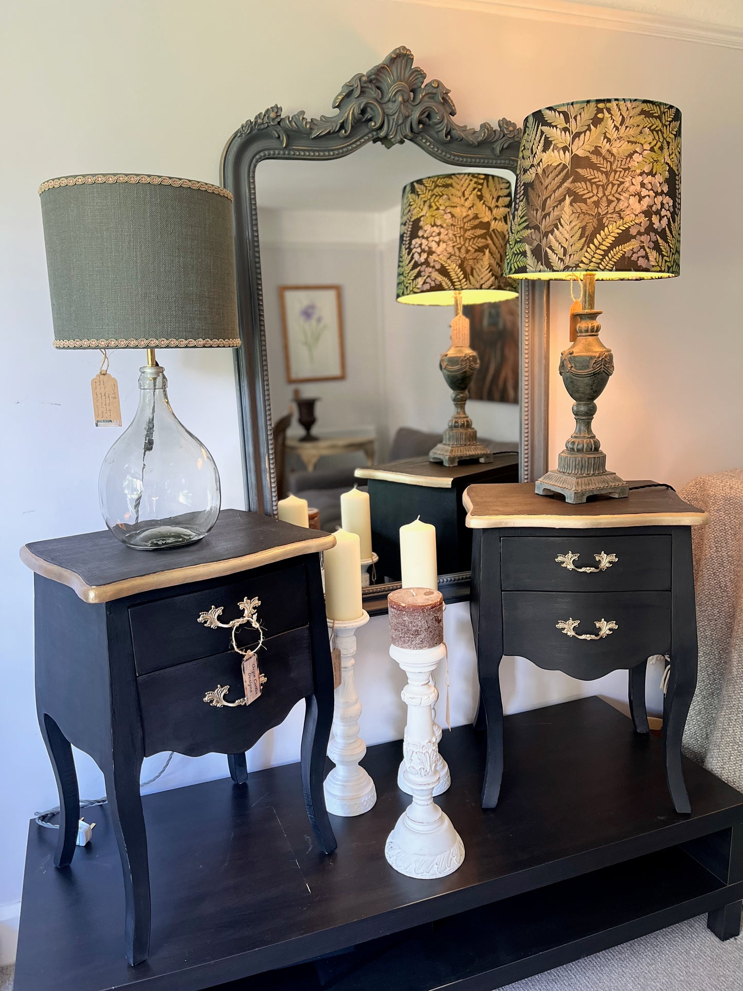 Pair of Louis Philippe-style bedside tables painted in matt black, adorned with gold painted handles and elegant gold detailing around the top, exuding luxury and classic sophistication
