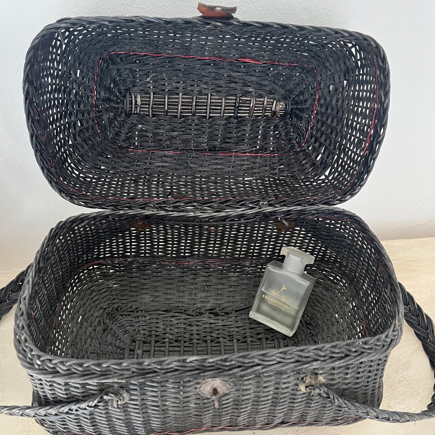 A Parisian handbag crafted from woven materials, showcasing intricate patterns and elegant design, inspired by French style