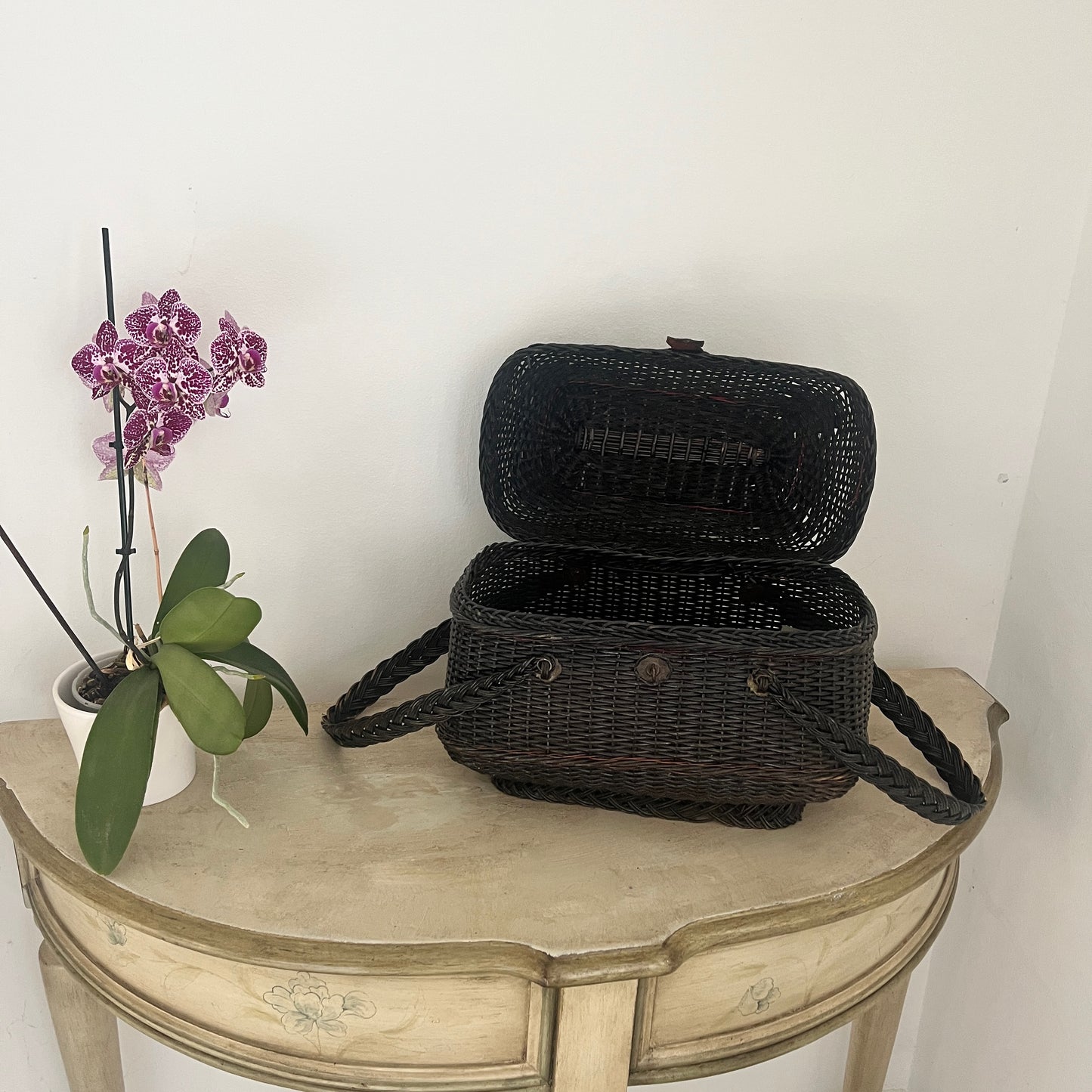 A Parisian handbag crafted from woven materials, showcasing intricate patterns and elegant design, inspired by French style