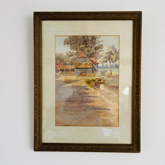 An antique watercolor painting of Loddon Bridge, depicting a serene riverside scene with a stone bridge arching over calm waters. The bridge features weathered stonework, flanked by lush greenery and trees in soft shades of green and brown.  
 Beside the bridge is an old farm building with a terracotta roof. The overall style is detailed yet gentle, characteristic of traditional watercolor techniques.