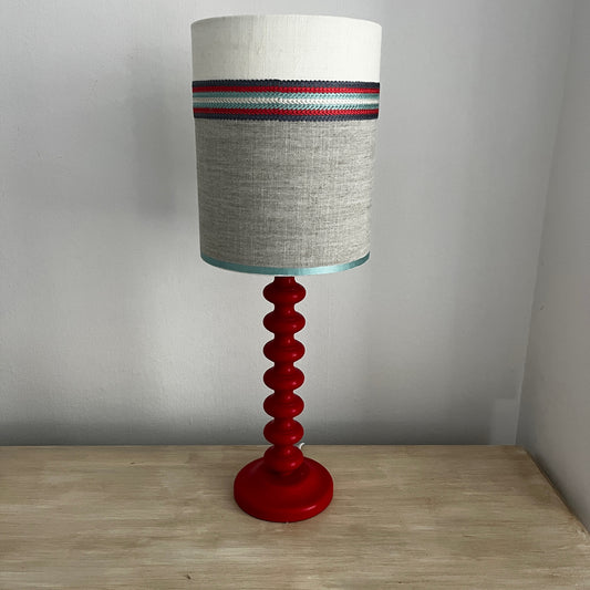 Hand-painted  mid-century style bobble lamp with a sculptural stacked base and a handmade fabric shade, featuring decorative detailing and a unique artisanal finish.
