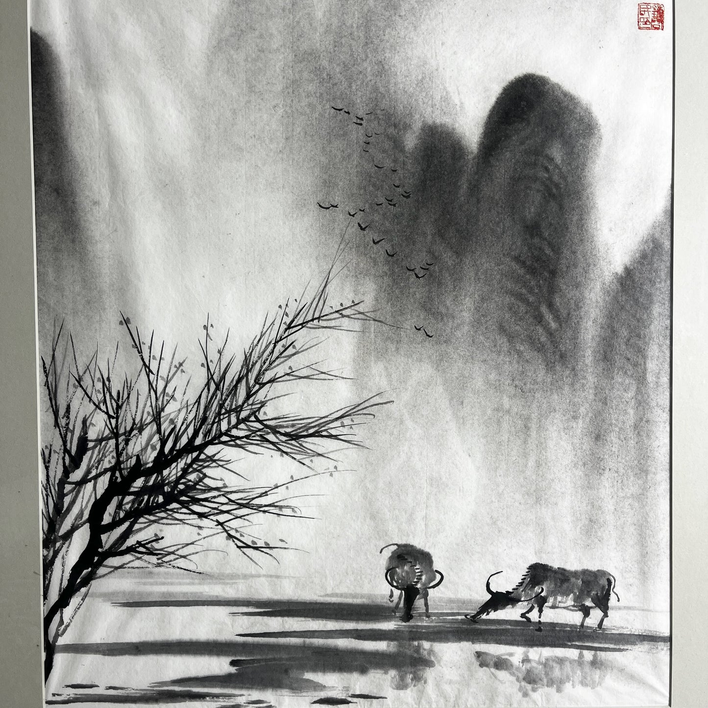 Original Chinese ink landscape painting on paper, attributed to Zhong Qi Min (Qi Min Zhong), depicting misty mountains and a tranquil riverside scene with two water buffalo. Trees appear in the foreground, with birds flying overhead, rendered in traditional expressive brushwork.