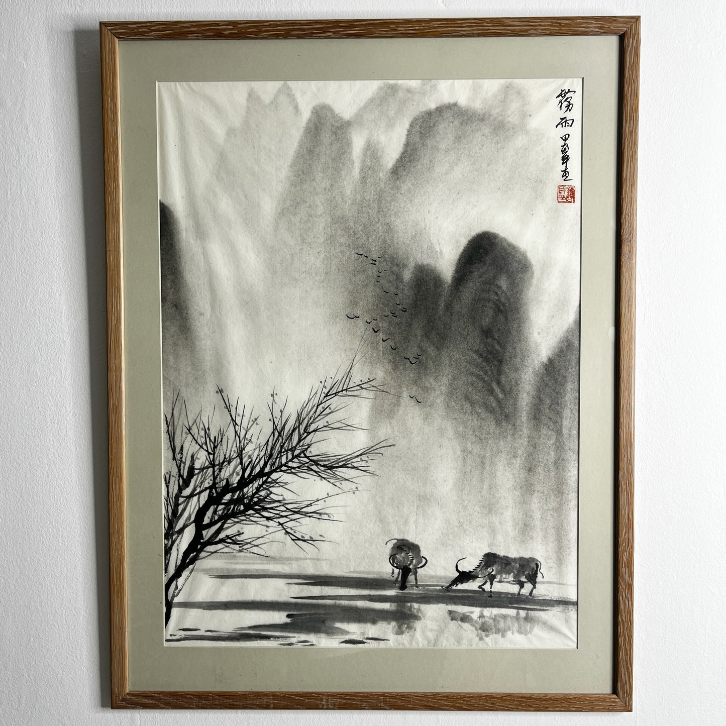 Original Chinese ink landscape painting on paper, attributed to Zhong Qi Min (Qi Min Zhong), depicting misty mountains and a tranquil riverside scene with two water buffalo. Trees appear in the foreground, with birds flying overhead, rendered in traditional expressive brushwork.