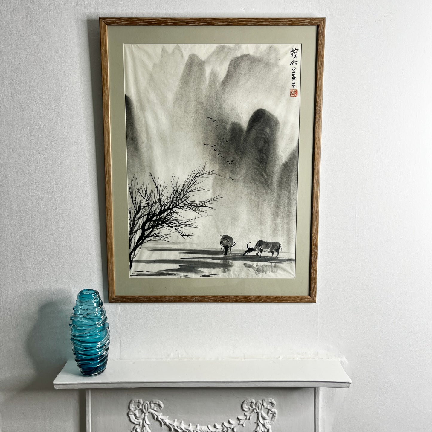 Original Chinese ink landscape painting on paper, attributed to Zhong Qi Min (Qi Min Zhong), depicting misty mountains and a tranquil riverside scene with two water buffalo. Trees appear in the foreground, with birds flying overhead, rendered in traditional expressive brushwork.