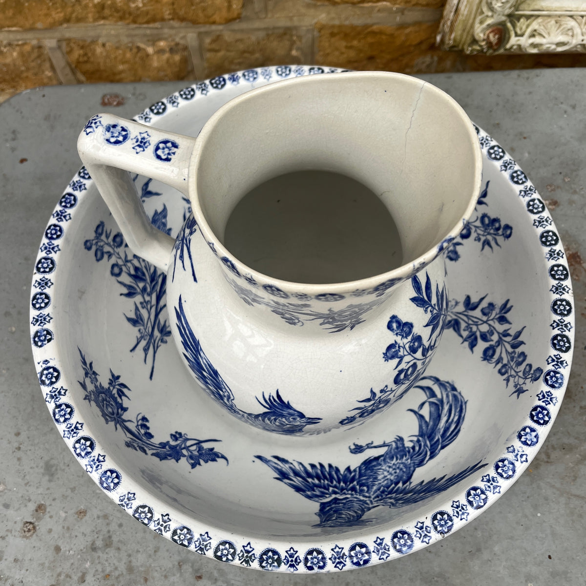 Antique French Sarreguemines blue and white transferware wash jug and bowl, decorated with a traditional cockerel pattern.