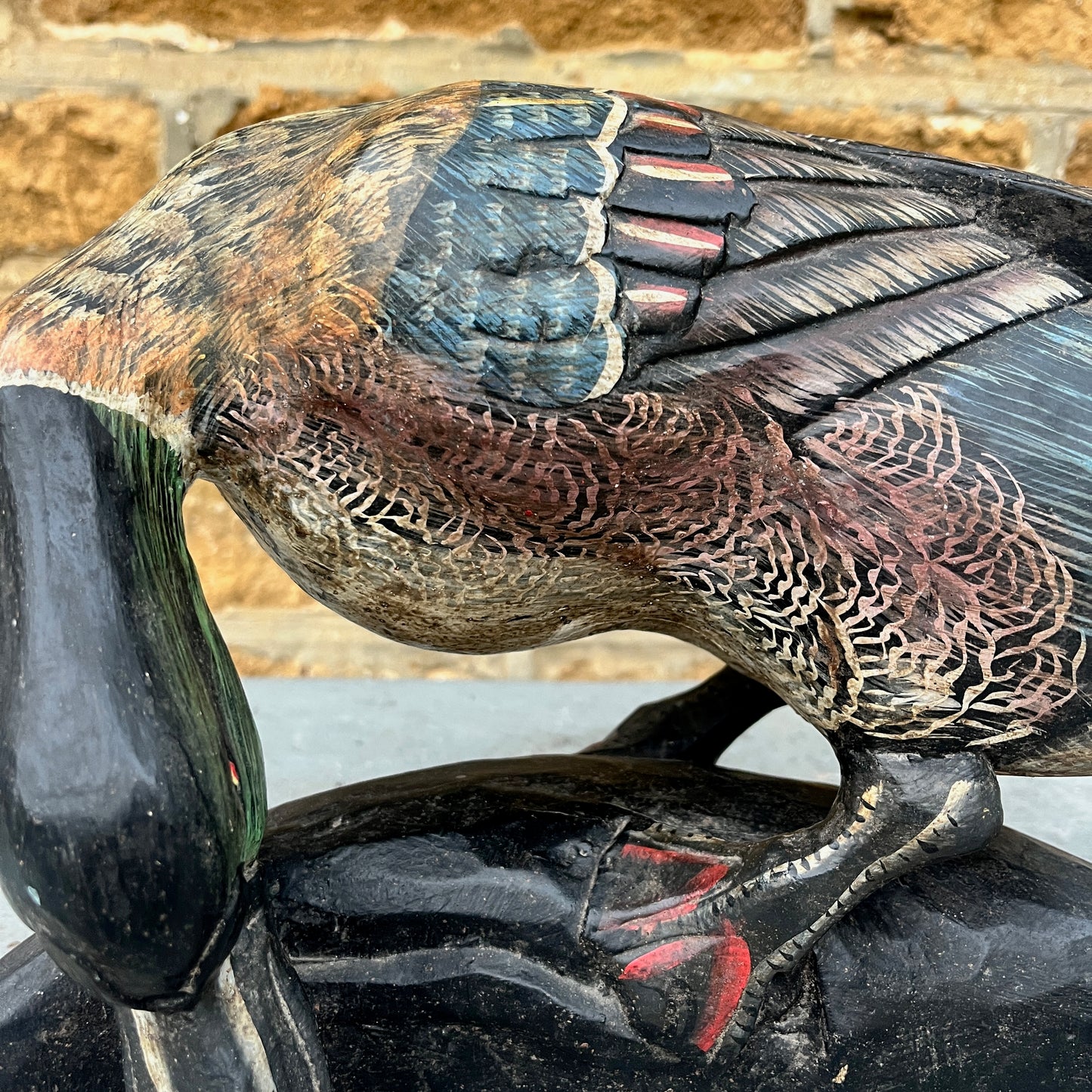 Vintage wooden duck figurine, hand-finished with painted details. The piece shows subtle signs of wear, highlighting its artisanal craftsmanship and rustic, decorative charm.