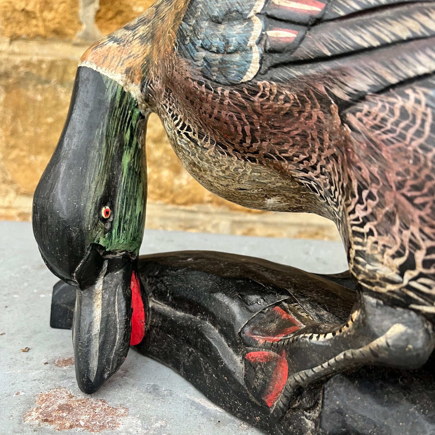 Vintage wooden duck figurine, hand-finished with painted details. The piece shows subtle signs of wear, highlighting its artisanal craftsmanship and rustic, decorative charm.