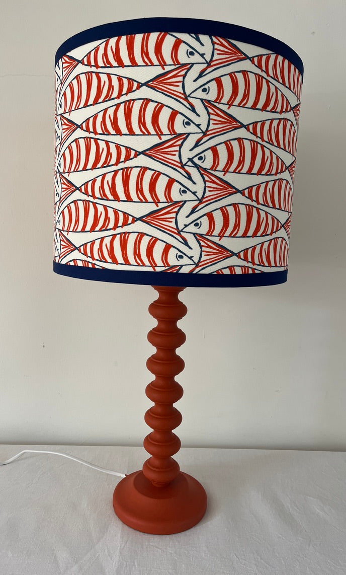 Orange mackerel lamp shade on a blue 'bobble' lamp base