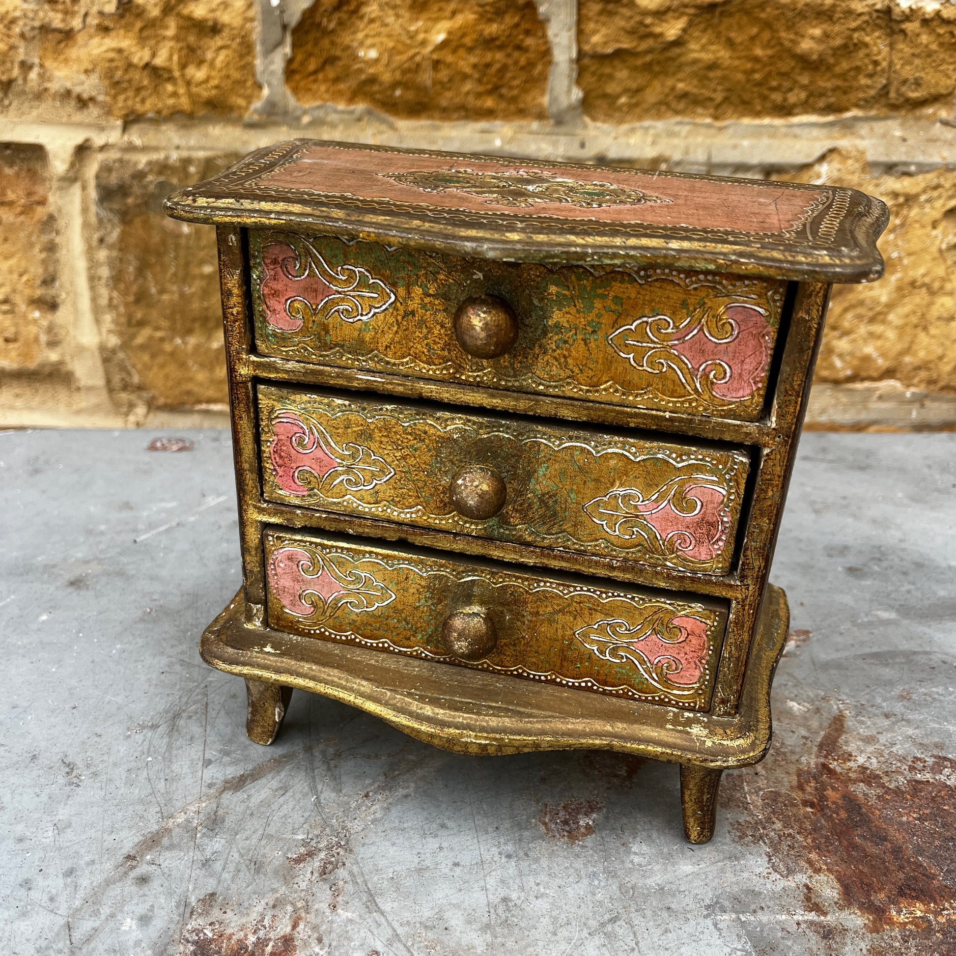 Vintage Italian Florentine miniature three-drawer chest of drawers with ornate carved and gilded decoration