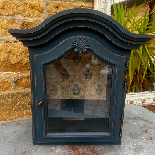 Vintage French blue clock cupboard with a classic rustic design and pretty paper to the rear of the cupboard.  