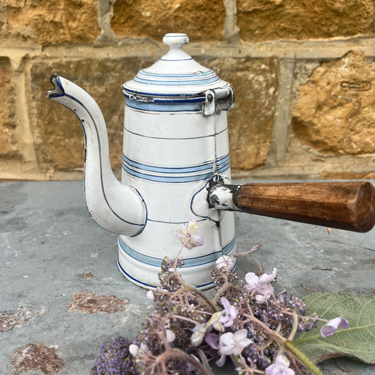 Vintage-style white coffee pot with blue stripes and wooden handle 