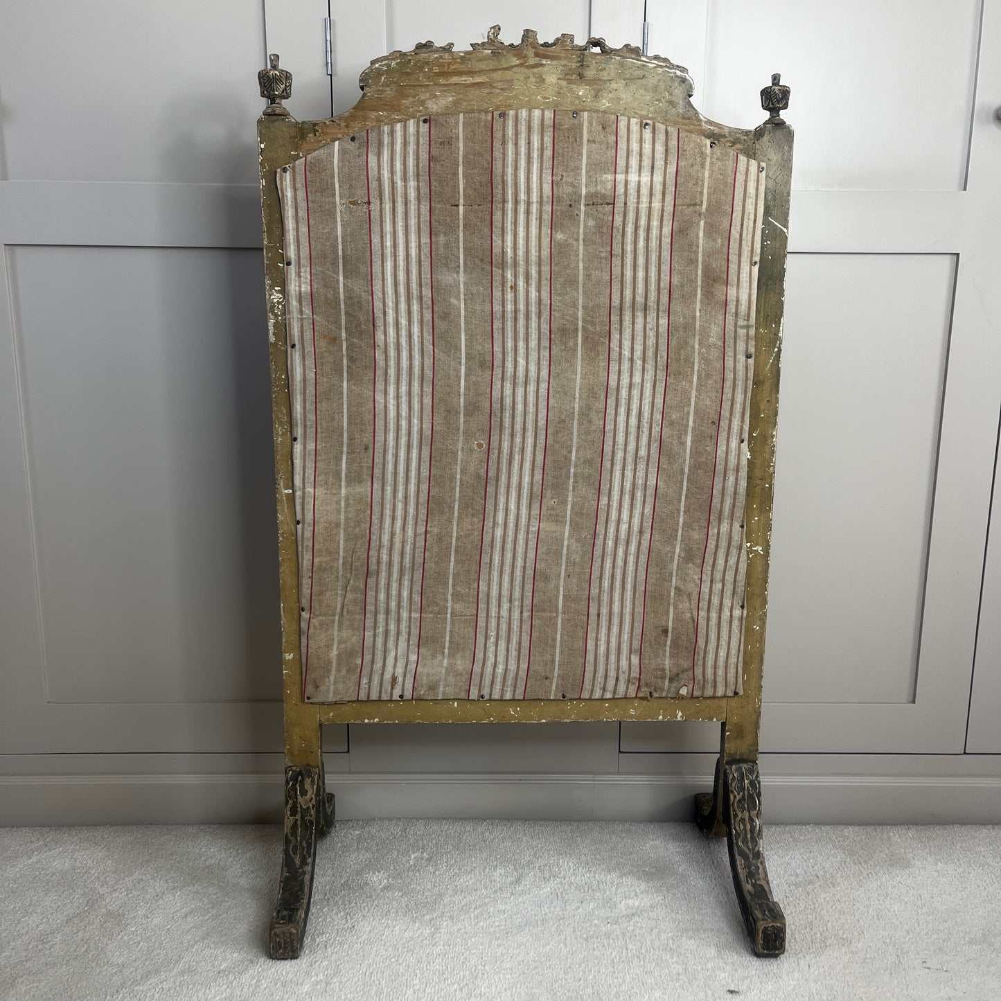 A vintage French fire screen featuring a classic Toile de Jouy fabric panel with an elegant pastoral scene in soft neutral tones