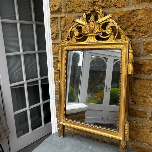 Antique French marriage mirror with an ornate gilt frame, featuring decorative gold detailing and traditional provincial craftsmanship.
