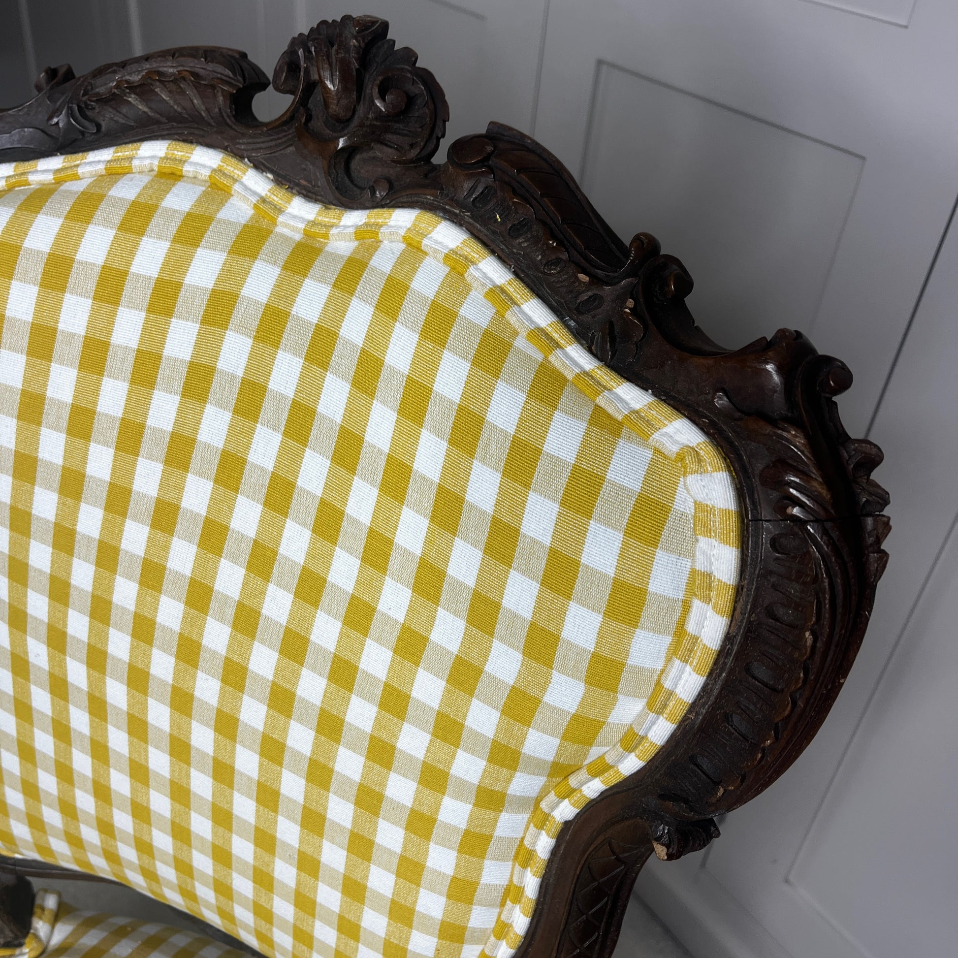 Pair of French salon chairs, newly upholstered in mustard gingham fabric, featuring elegant wooden frames and classic curved backs.