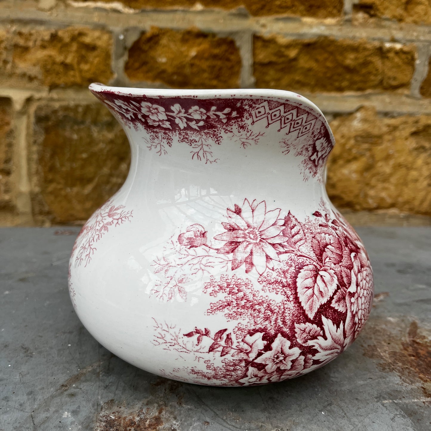 Antique French red transferware ironstone jug by Moulin des Loups, decorated with intricate red patterns and traditional detailing