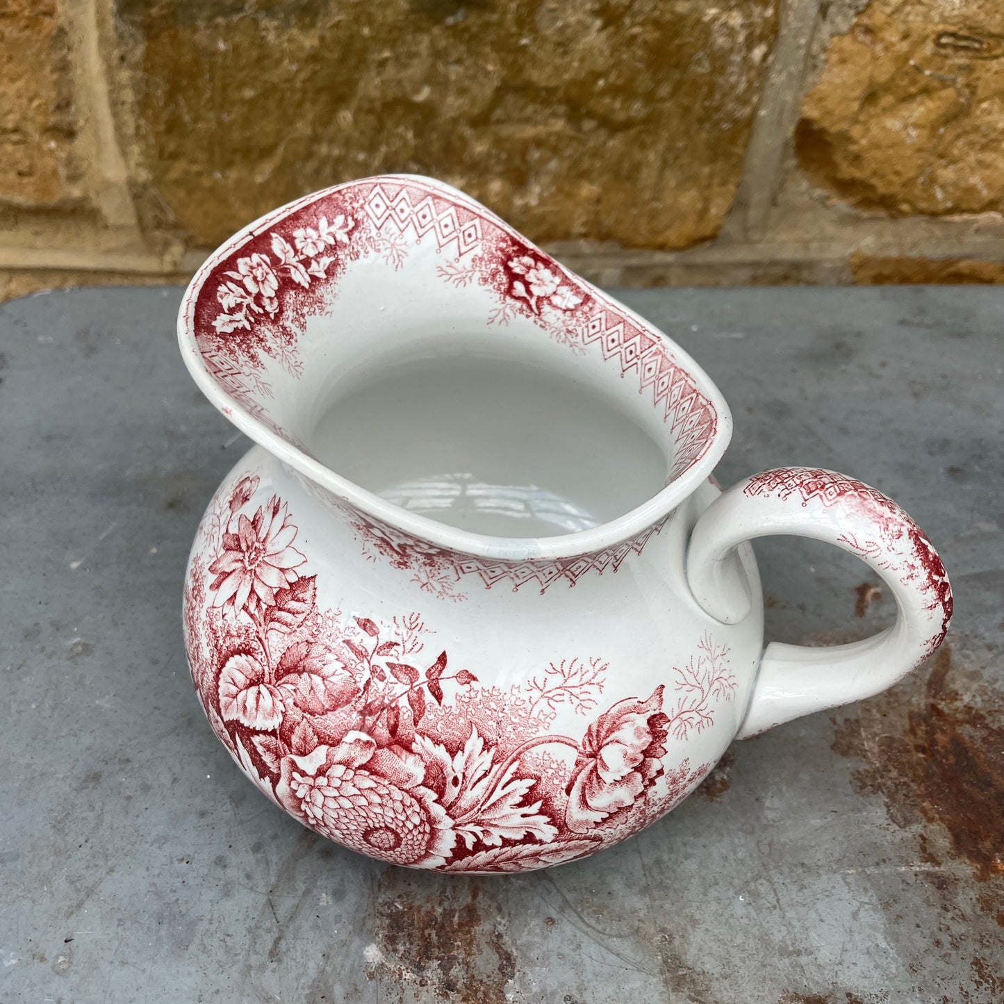 Antique French red transferware ironstone jug by Moulin des Loups, decorated with intricate red patterns and traditional detailing
