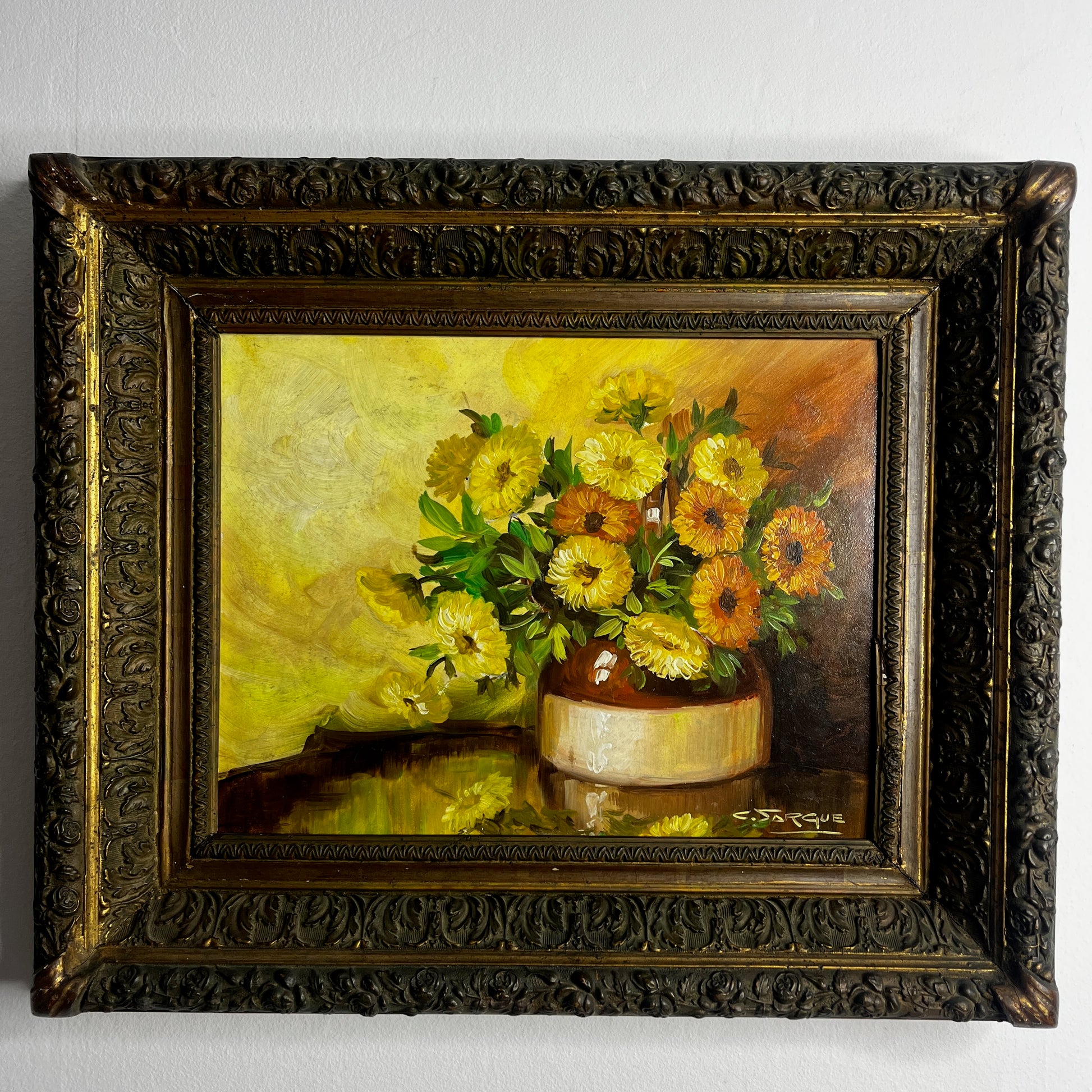 Vintage French still life painting of marigolds, featuring warm golden tones and a classic rustic composition in a rustic stoneware pot.